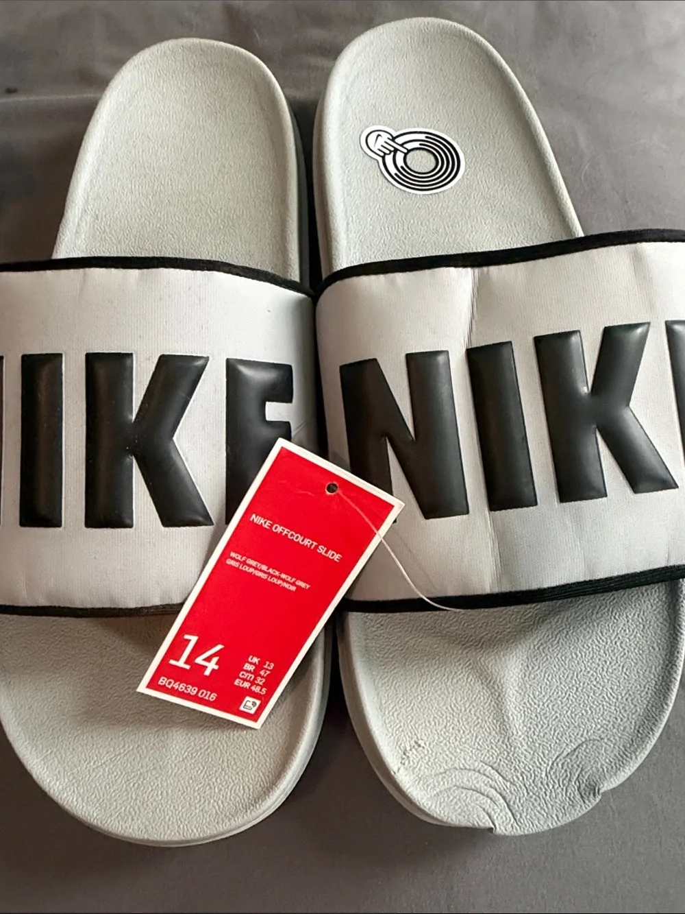 Nike Slide Sandals Brand new w tag but you can see slight damage to left front